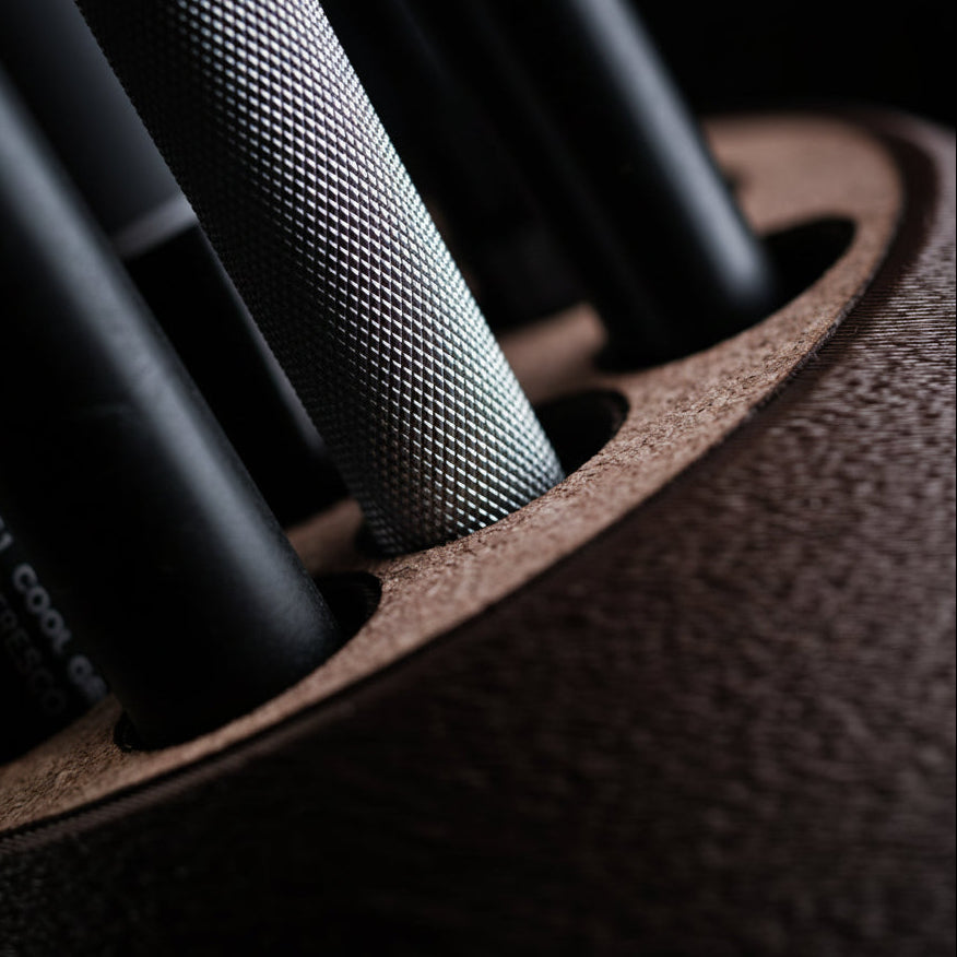 Close-up of a car seat cover with stitching detail, featuring the H310 brand logo.